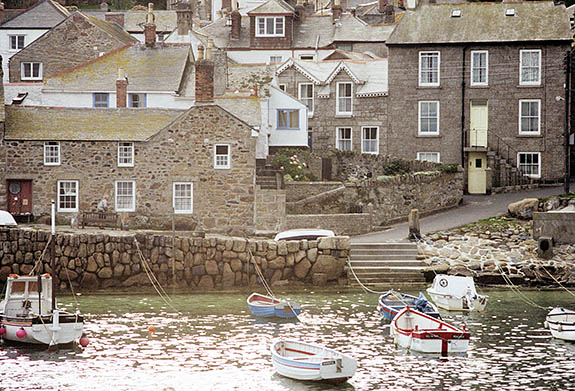 ENG: Cornwall , Cornwall AONB, Penwith Peninsula, Mousehole. View of village across harbor in late afternoon sun [Ask for #158.074.]