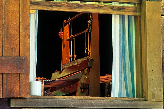 North Carolina: Central Mountains Region, Transylvania County, Pisgah National Forest, Davidson River Area, The Cradle of Forestry In America, Hand loom, viewed through window of log cabin [Ask for #212.208.]