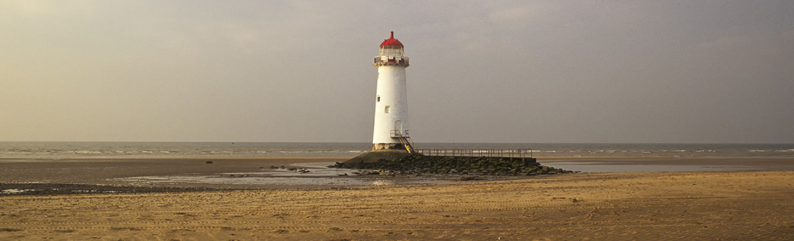 WAL: Northern Region, Flintshire County, The Mouth of the Dee Estuary, Talacre, Point of Ayr Lighthouse, Sunset view, over beach [Ask for #246.199.]