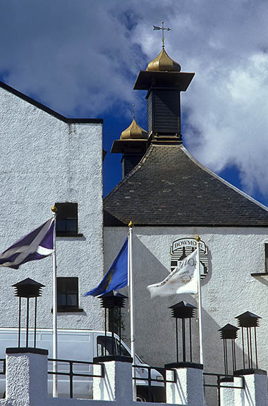 SCO: Argyll & Bute , Inner Hebrides, Islay, Bowmore, Bowmore Distillery. Front, showing malt drying kilns with their distinctive cupolas [Ask for #246.388.]