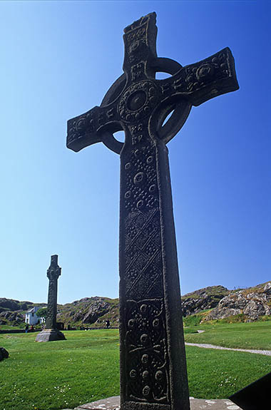 SCO: Argyll & Bute , Inner Hebrides, off Mull, Isle of Iona, Iona Abbey. Entrance to 13th C abbey; St. John's Cross (replica of 8th C Celtic Cross that stood here); St. Martin's Cross, 8th C Celtic Cross (lt bkg); Tor An Aba (rt bkg) [Ask for #246.627.]