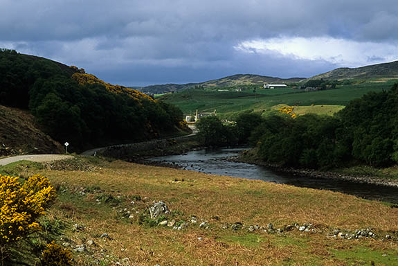 SCO: Highland Region, Sutherland District, Central Moors, Strathnaver, View over the River Naver, the site of infamous 19th c. Clearances, as late afternoon sun breaks through storm clouds [Ask for #246.837.]