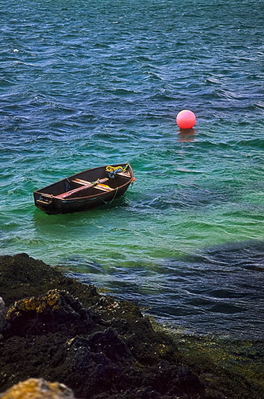 SCO: Highland Region, Sutherland District, Northern Coast, Durness, Kyle of Durness, Small wooden rowboat tied to cliffs on the Kyle of Durness, a tidal bay. [Ask for #246.867.]