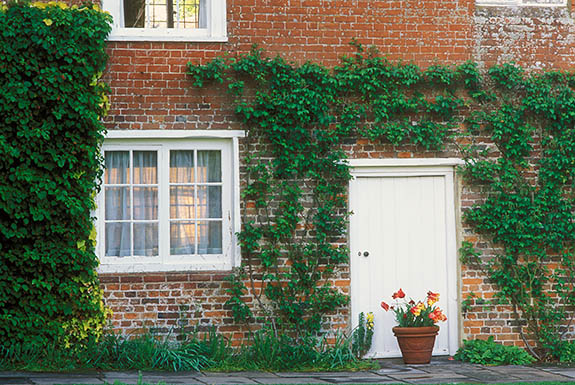 ENG: Hampshire , South Downs National Park, Chawton, Jane Austin's House. Front of house, with spring flowers, in late afteroon shade. [Ask for #253.003.]