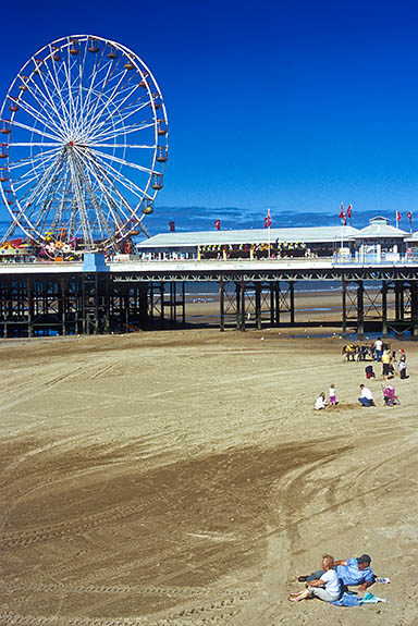 ENG: Blackpool Borough, Southern Beachfront, The Golden Mile, People enjoy the low tide sands beneath the pier; Ferris wheel prominent [Ask for #262.026.]
