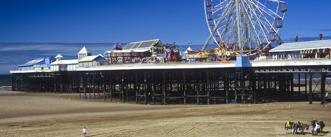ENG: Blackpool Borough, Southern Beachfront, The Golden Mile, People enjoy the low tide sands beneath the pier; Ferris wheel prominent [Ask for #262.029.]