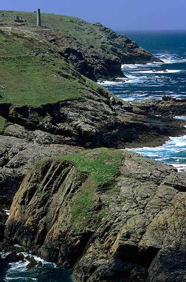ENG: Cornwall , Cornwall AONB, Penwith Peninsula, Pendeen Watch. View south along the cliffs, with the abandoned Geevor tin mine ruins in the background [Ask for #268.223.]