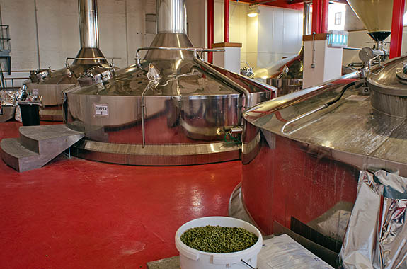 ENG: West Midlands Region, Staffordshire, The Trent Valley, Burton-on-Trent, Marstons Brewery, Shobnall, Mash tuns, in the brewery building, showing hops [Ask for #270.226.]