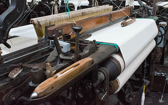 ENG: The Northwest Region, Lancashire, The Pennines, Burnley Borough, Briercliffe, Queen Street Mill, Belt-powered looms fill the factory floor of this fully functional steam powered Victorian textile plant [Ask for #270.397.]