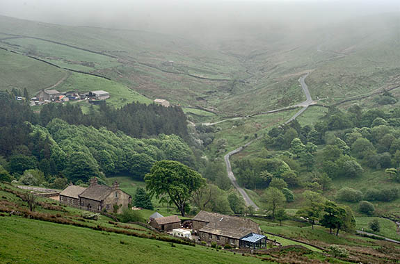 ENG: Lancashire , The Pennines, Pendle, Wycoller Moors. Lane climbs past isolated Pennine farmstead to open moors, in fog [Ask for #270.443.]